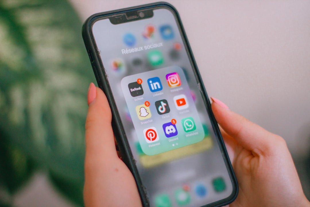 a-person-holding-a-cell-phone-in-their-hand-6fc2lxmaizm